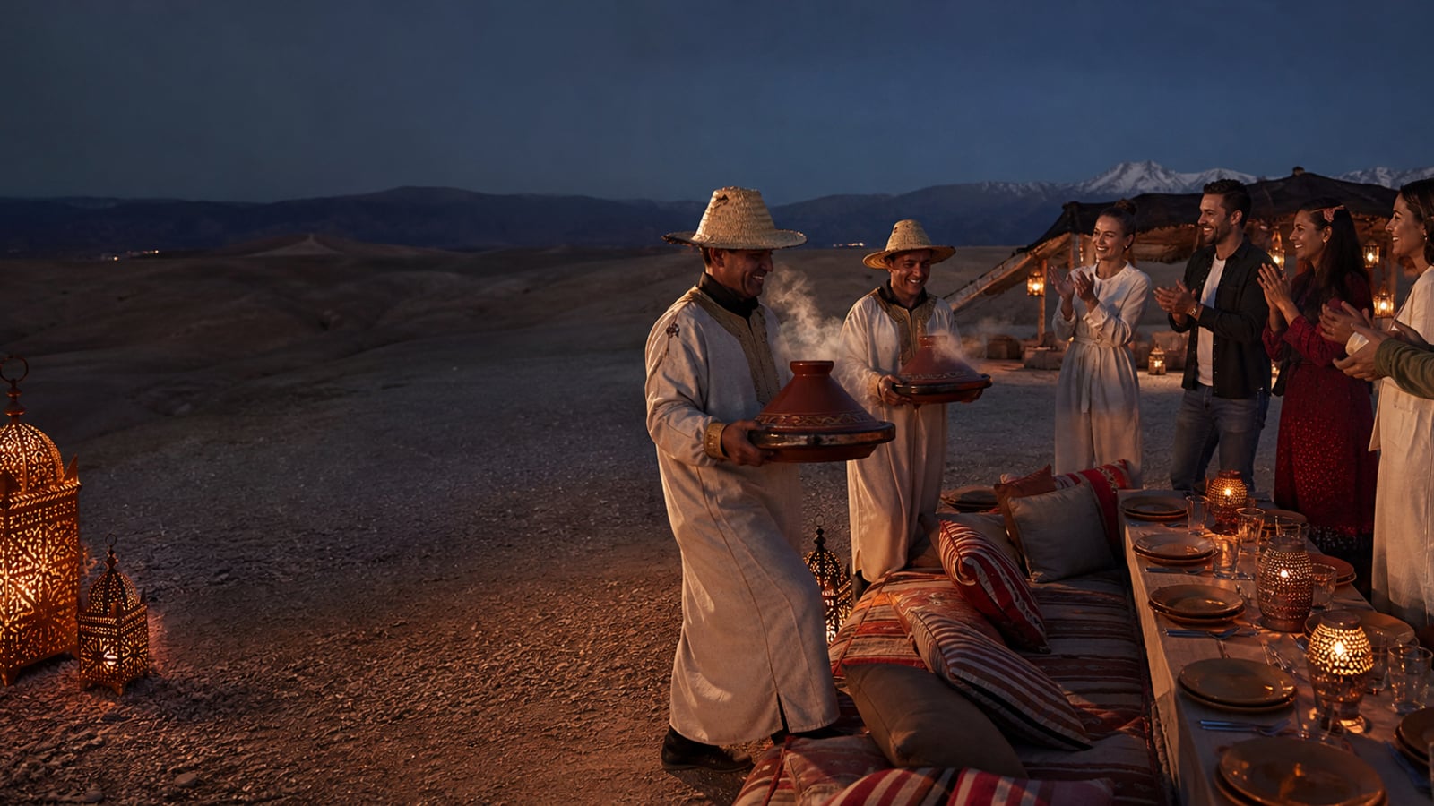 Travellers welcoming steaming tagines at a lantern-lit Agafay dinner camp