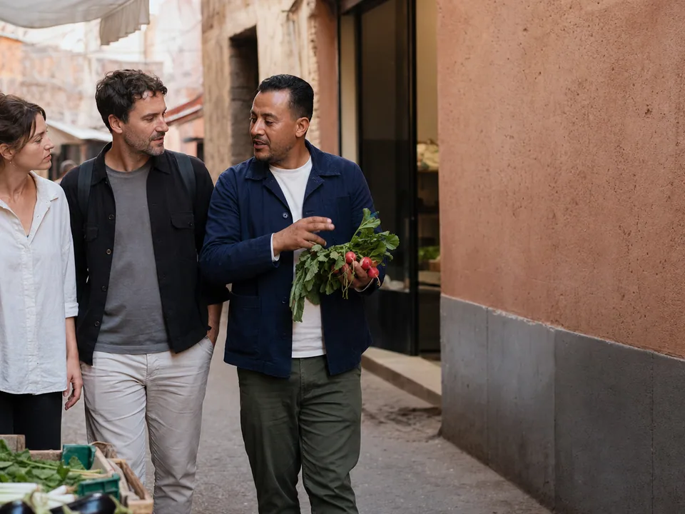 Walking through a sunlit medina alley with a local guide